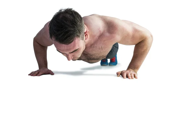 Strong bodybuilder doing press up — Stock Photo, Image