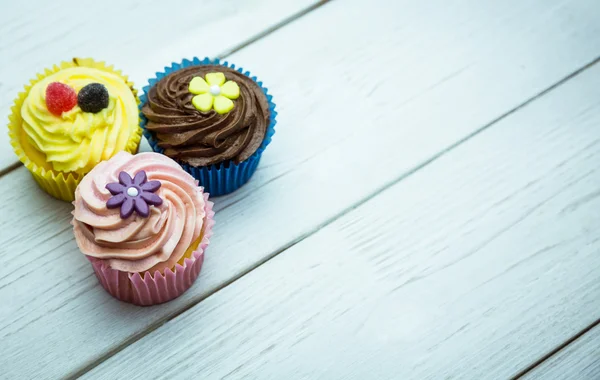 Delicious cupcakes on a table — Stock Photo, Image