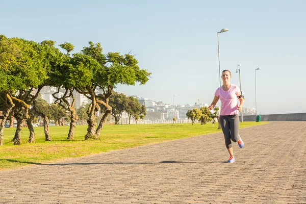 Blonde jogging at promenade — Stock Photo, Image