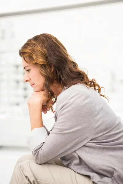 Thoughtful casual businesswoman — Stock Photo, Image