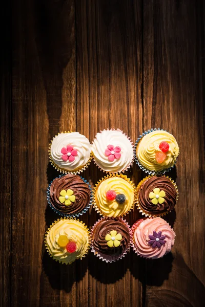 Delicious cupcakes on a table — Stock Photo, Image