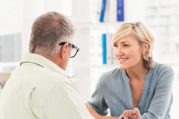 Smiling business team talking — Stock Photo, Image