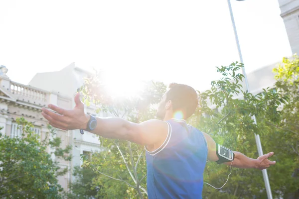 Athlete with arms outstretched — Stock Photo, Image