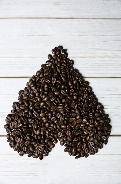 Beans on a table in heart shape — Stock Photo, Image