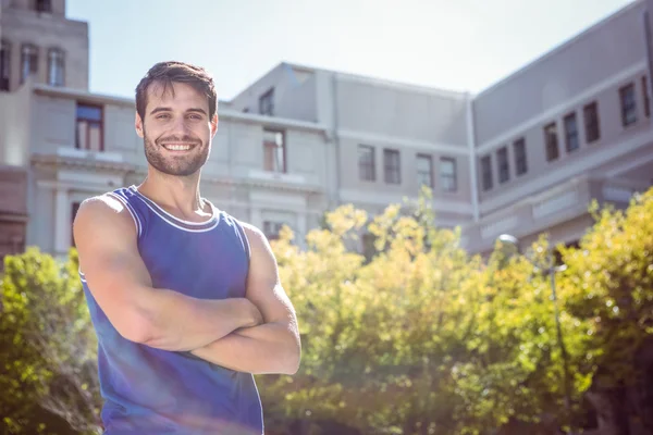 Handsome athlete with arms crossed — Stock Photo, Image