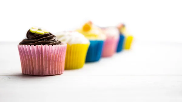 Delicious cupcakes on a table — Stock Photo, Image