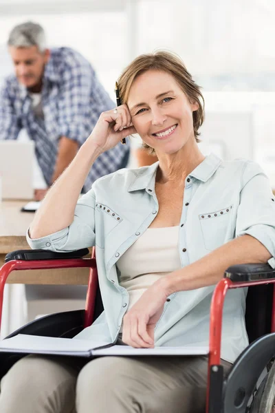 Casual businesswoman in wheelchair — Stock Photo, Image