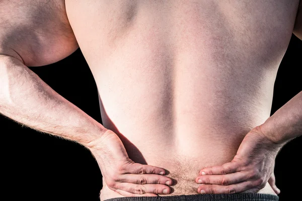 Bodybuilder with painful back — Stock Photo, Image