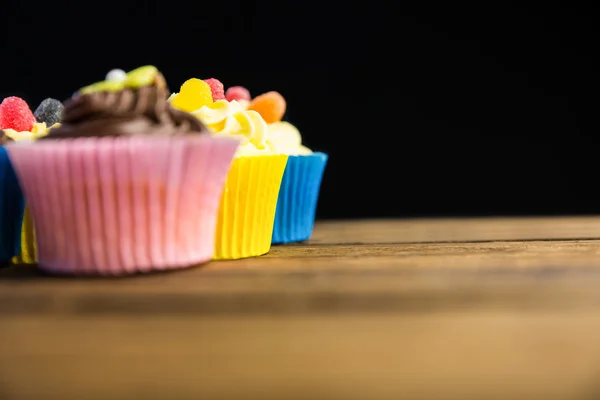 Delicious cupcakes on a table — Stock Photo, Image