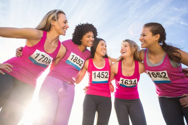 Smiling runners supporting marathon — Stock Photo, Image