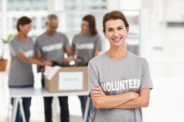 Volunteer with arms crossed — Stock Photo, Image