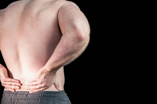 Strong bodybuilder with painful back — Stock Photo, Image