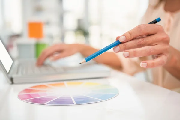 Casual designer working with laptop — Stock Photo, Image