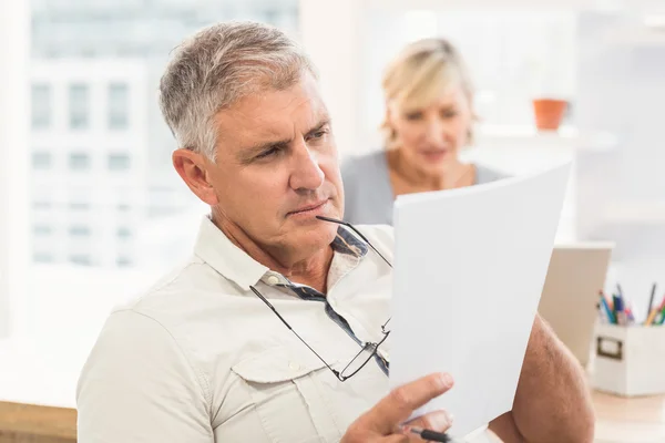 Attentive businessman reading — Stock Photo, Image