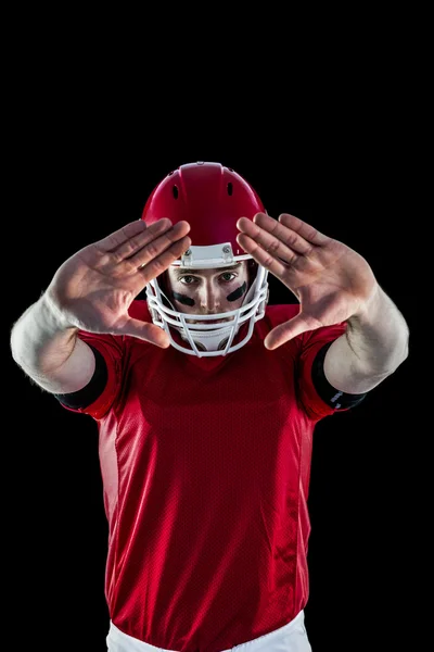 Football player protecting himself — Stock Photo, Image