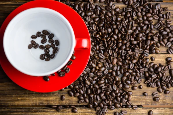 Beans on a table with cup — Stock Photo, Image