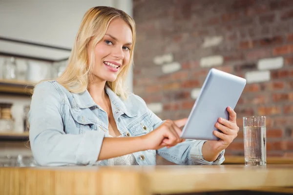 Blonde touching on tablet computer — Stock Photo, Image