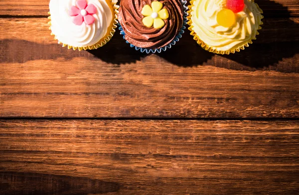 Delicious cupcakes on a table — Stock Photo, Image