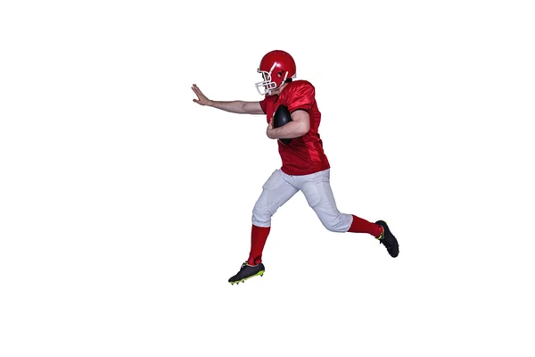 Jogador de futebol correndo com a bola — Fotografia de Stock