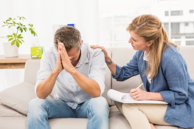 therapist comforting male patient clipart