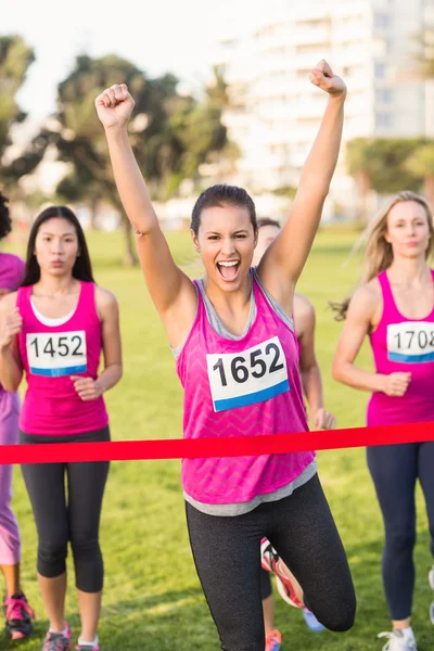 Cheering brunette winning  marathon — Stock Photo, Image