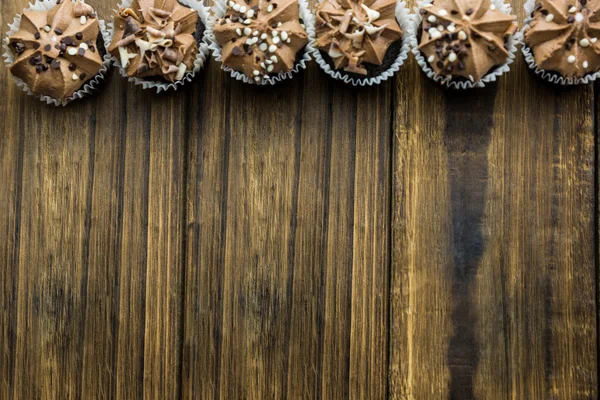Chocolate cupcakes on a table — Stock Photo, Image