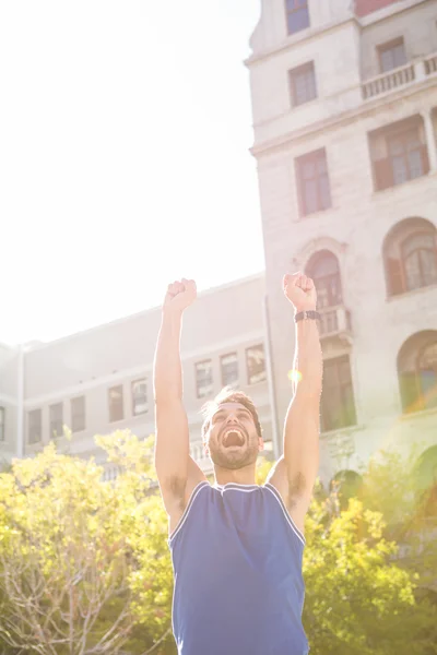 Handsome athlete triumphing — Stock Photo, Image