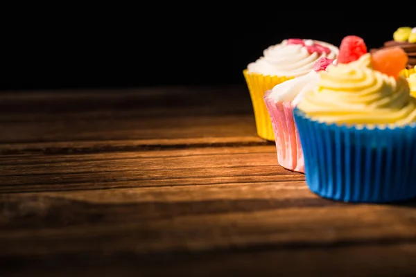 Delicious cupcakes on a table — Stock Photo, Image