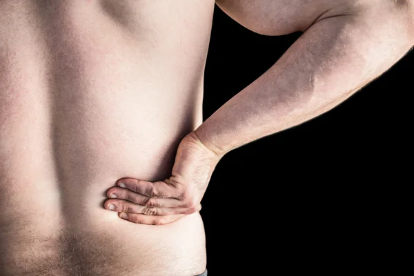 Starker Bodybuilder mit schmerzhaftem Rücken — Stockfoto