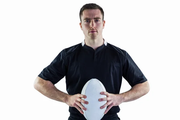 Jogador segurando uma bola de rugby — Fotografia de Stock