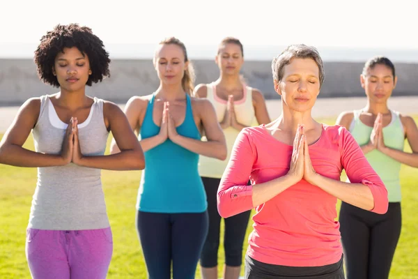 Women doing prayer position — Stock Photo, Image