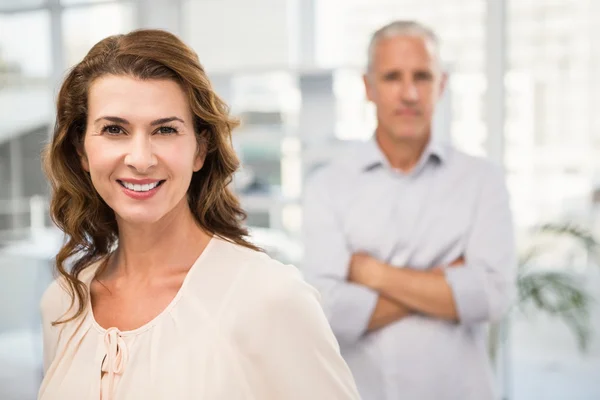 Businesswoman in front of her colleague — Stock Photo, Image