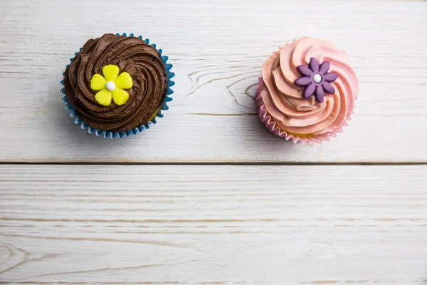 Delicious cupcakes on a table — Stock Photo, Image