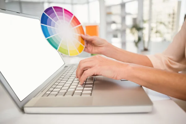 Casual designer working with laptop — Stock Photo, Image