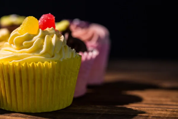 Delicious cupcakes on a table — Stock Photo, Image