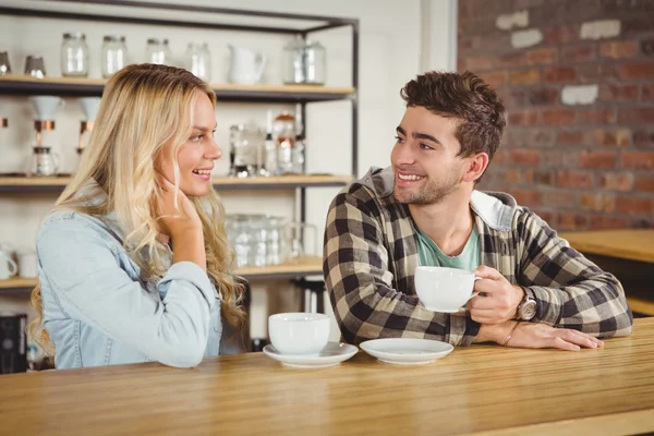 Hipsters sitting and enjoying coffee — Stock Photo, Image