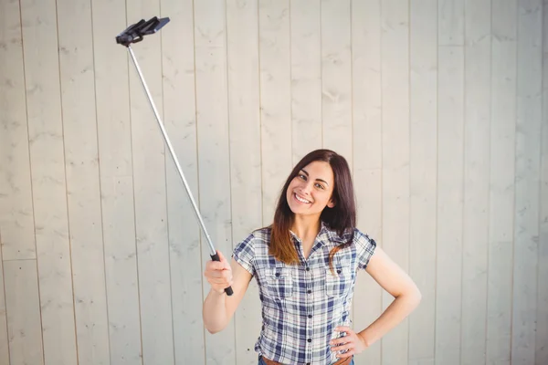 Hipster taking a selfie with stick — Stock Photo, Image