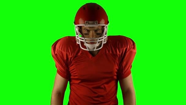 Red serious american football player posing — Stock Video