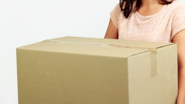 Woman holding a large cardboard box — Stock Video