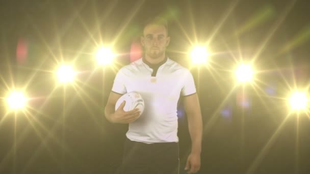 Serious rugby player brings rugby ball — Stock Video