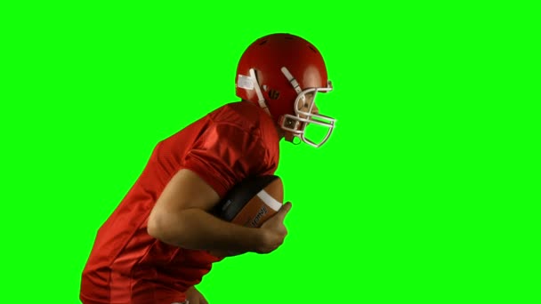Red american football player posing — Stock Video