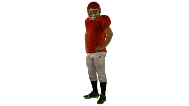 Red serious american football player posing — Stock Video