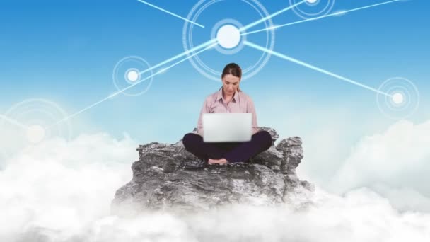 Businesswoman using laptop in the clouds — Stock Video