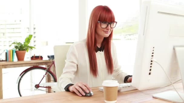 Red haired hipster using a computer — Stock Video
