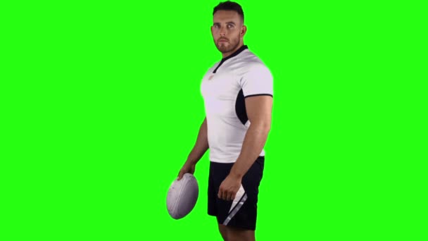 Serious rugby player holding ball — Stock Video