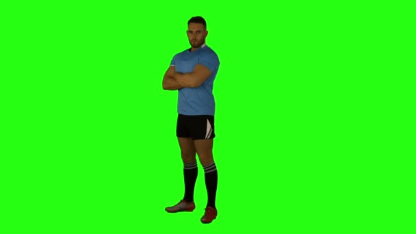 Serious rugby player with arms crossed — Stock Video