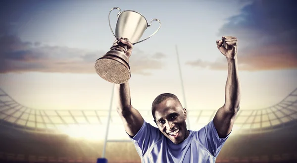 Sportsman holding trophy — Stock Photo, Image