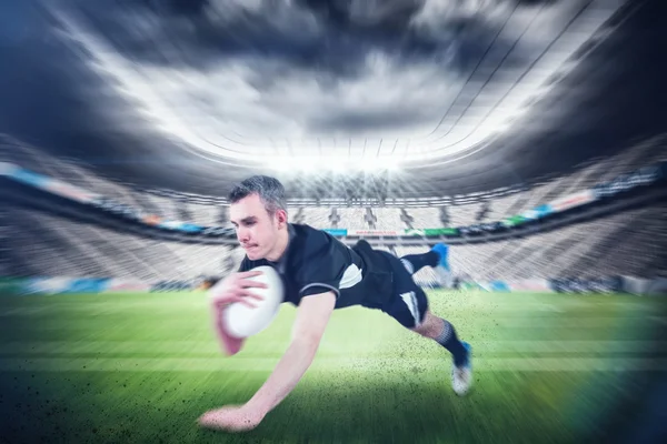 Jugador de rugby anotando un intento — Foto de Stock