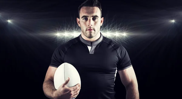 rugby player holding ball