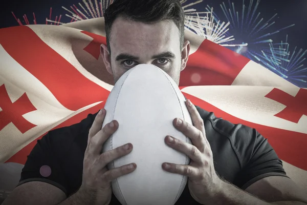 Rugby player holding ball — Stock Photo, Image